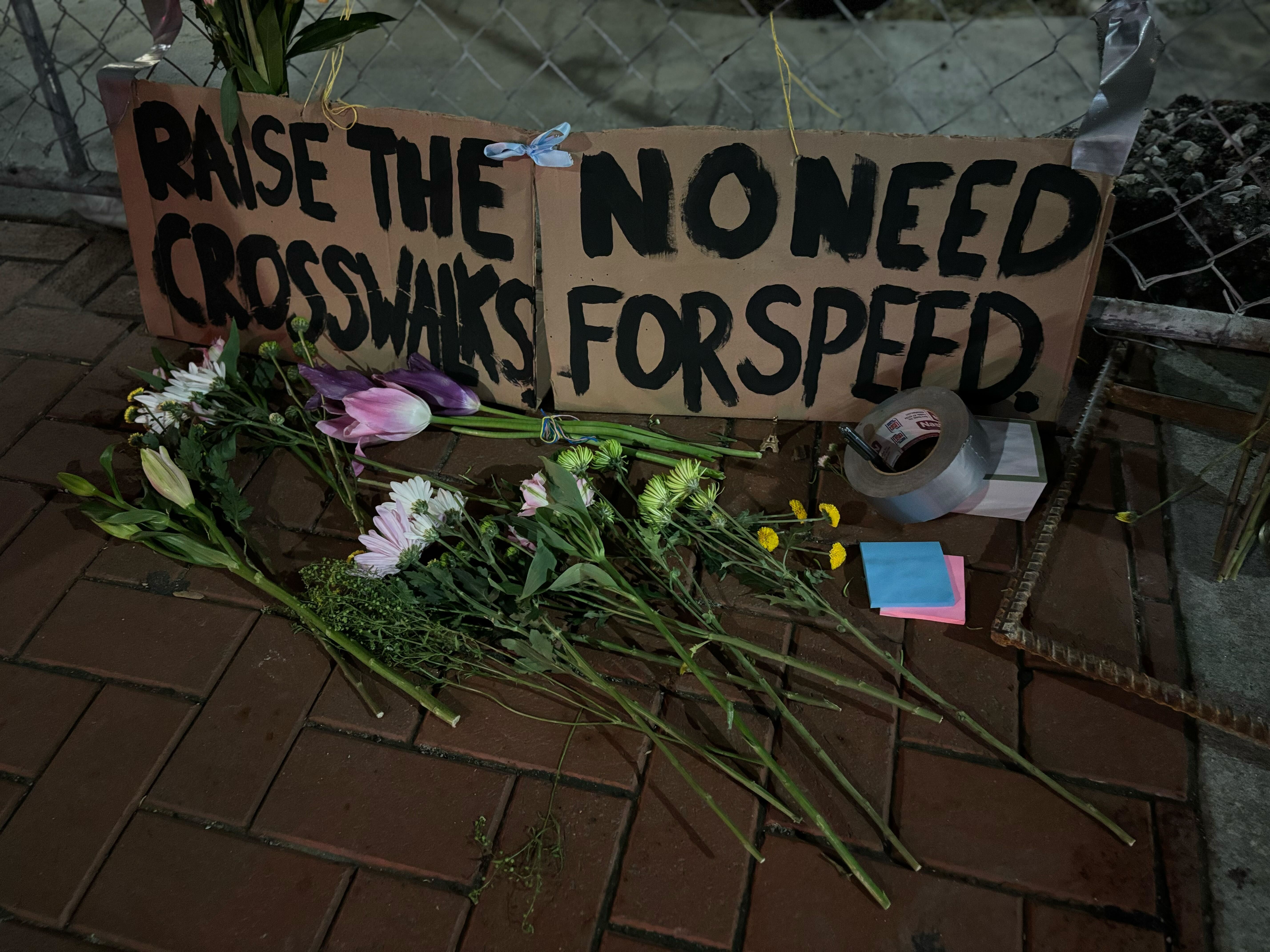 Memorial on sidewalk.