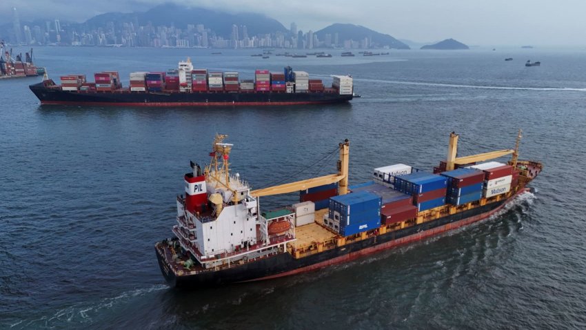 Vessels carrying shipping containers sail near Kwai Tsing Container Terminal in Hong Kong, China, April 23, 2025.