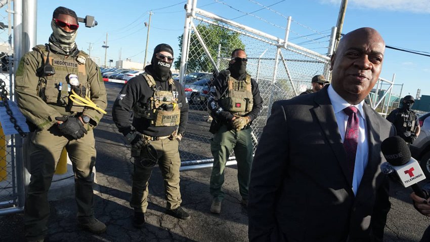 Mayor Ras Baraka of Newark speaks to the press near ICE agents at a demonstration outside an immigrant detention centre in Elizabeth, New Jersey May 7, 2025.