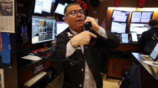 Traders work on the floor at the New York Stock Exchange (NYSE) in New York City, U.S., May 12, 2025.