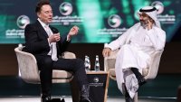 Tesla CEO Elon Musk speaks, as he sits with Saudi Minister of Communications and Information Technology Abdullah Alswaha, at the Saudi-U.S. Investment Forum, in Riyadh, Saudi Arabia, May 13, 2025.