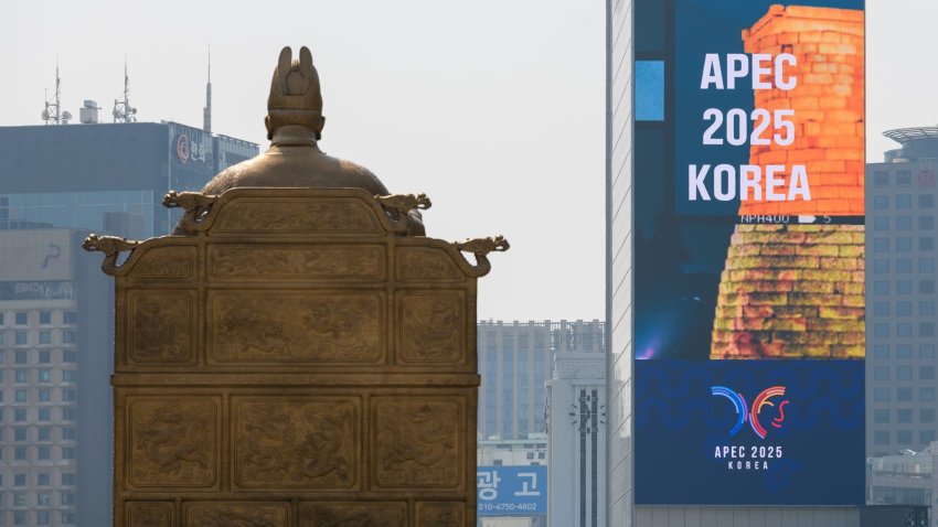 SEOUL, SOUTH KOREA – 2025/04/16: An APEC 2025 large-scale promotional video and a statue of King Sejong the Great are seen at Gwanghwamun Square in central Seoul.