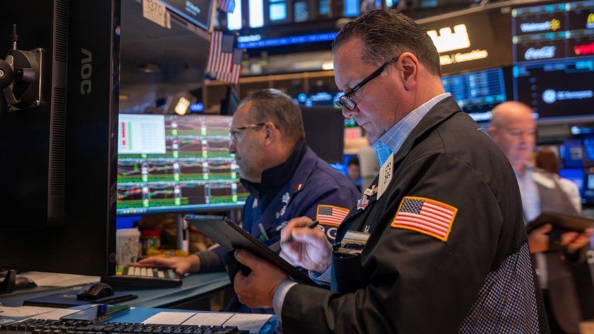 Traders work on the floor of the New York Stock Exchange (NYSE) on May 19, 2025 in New York City.