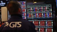 Traders work on the floor of the New York Stock Exchange (NYSE) at the opening bell on May 27, 2025, in New York City.
