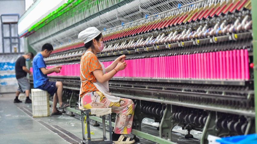 A worker works in a workshop of a textile products manufacturing enterprise in Qingzhou Economic Development Zone in Qingzhou City, Shandong Province, China, on May 10, 2025.