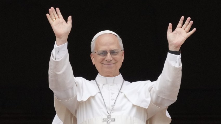 Pope Leo XIV appears at the central balcony of St. Peter's Basilica for his first Sunday blessing after his election, in St. Peter's Square at the Vatican, Sunday, May 11, 2025.(AP Photo/Gregorio Borgia)