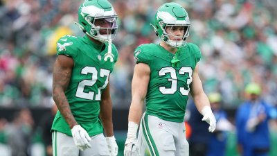 PHILADELPHIA, PENNSYLVANIA – DECEMBER 29: Quinyon Mitchell #27 and Cooper DeJean #33 of the Philadelphia Eagles look on against the Dallas Cowboys at Lincoln Financial Field on December 29, 2024 in Philadelphia, Pennsylvania. (Photo by Mitchell Leff/Getty Images)