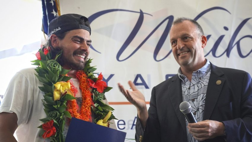 Governor Josh Green presents a proclamation to Oliver Widger, 29-year-old Oregon man who sailed from Oregon to Hawai’i, on Saturday, May 24, 2025 in Waikiki, Hawaii. (AP Photo/Michelle Bir)