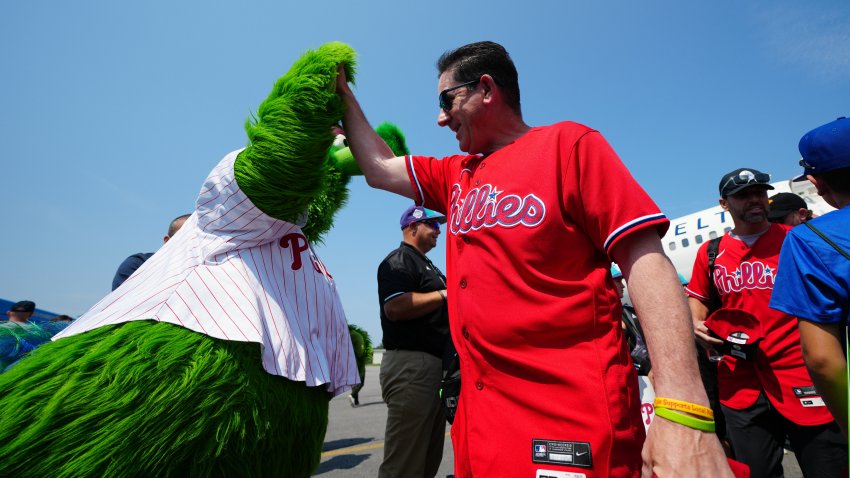 Phillies Phanatic high fives Rob Thomson