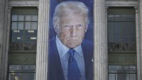 A banner showing an image of Donald Trump hangs on the side of a U.S. Department of Agriculture building in Washington, D.C., on May 16, 2025. The banner was put up to mark the the 163rd anniversary of the Department of Agriculture which was founded on May 15, 1862, by Abraham Lincoln.