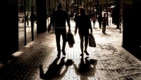 Shoppers carry bags on Market Street in San Francisco, California, US, on Wednesday, Nov. 13, 2024.