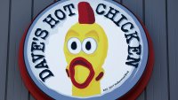 The Dave’s Hot Chicken logo is displayed at a Dave’s Hot Chicken restaurant on February 26, 2025 in Rosemead, California. 