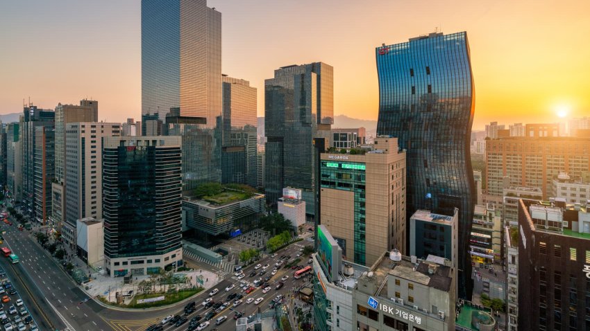 Sunset scene of light trails traffic speeds through an intersection in Gangnam center business district of Seoul at Seoul city, South Korea