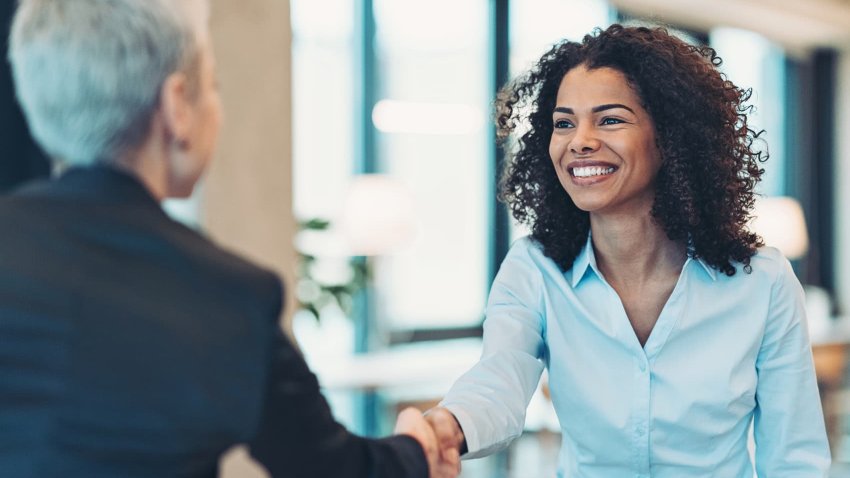 Businesswomen shaking hands in the office