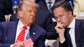 US President Donald Trump (R) speaks with NATO Secretary General Mark Rutte as they attend the North Atlantic Council plenary meeting at the North Atlantic Treaty Organisation (NATO) summit in The Hague on June 25, 2025.  (Photo by Ludovic MARIN / POOL / AFP) (Photo by LUDOVIC MARIN/POOL/AFP via Getty Images)