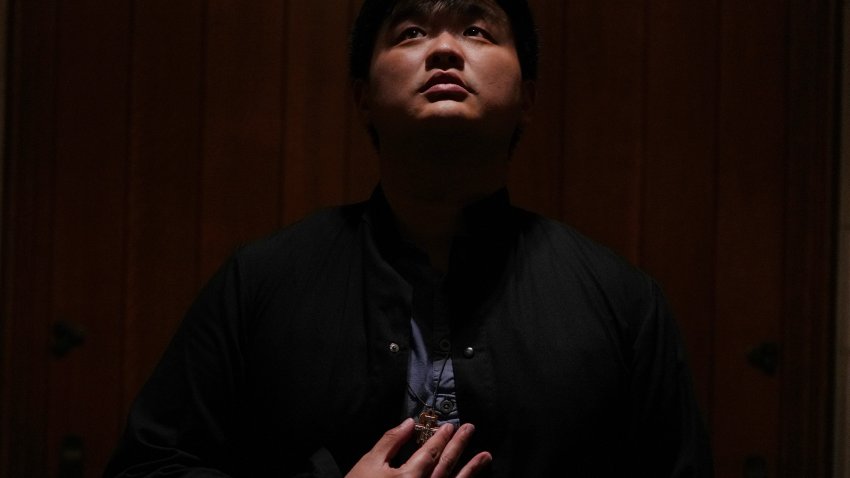 David Kim, a Catholic altar server, stands for a portrait before a Mass at the Princeton University chapel in Princeton, N.J., on Friday, May 16, 2025.