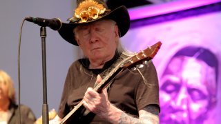 FILE - Johnny Winter performs at the 2014 New Orleans Jazz & Heritage Festival at Fair Grounds Race Course, May 3, 2014, in New Orleans.
