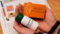 A coordinator shows the medications and care kit, which will be sent out the clients at Massachusetts Medication Abortion Access Project, May 13, 2025, in Somerville, Mass. (AP Photo/Charles Krupa)