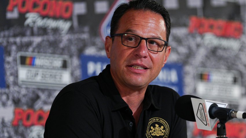 Pennsylvania Gov. Josh Shapiro talks to the media prior to a NASCAR Cup Series auto race at Pocono Raceway, Sunday, June 22, 2025, in Long Pond, Pa.