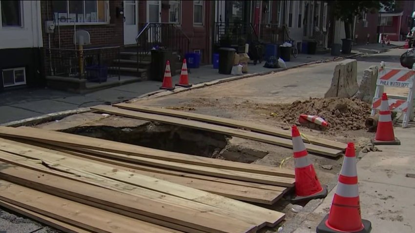 A sinkhole along Sigel Street in Philadelphia's Point Breeze neighborhood has lingered since April.