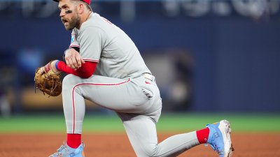 TORONTO, ON – JUNE 4: Bryce Harper #3 of the Philadelphia Phillies kneels in a break in play against the Toronto Blue Jays in their MLB game at the Rogers Centre on June 4, 2025 in Toronto, Ontario, Canada. (Photo by Mark Blinch/Getty Images)