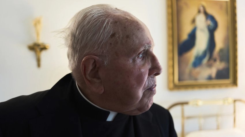 The Rev. James Kelly looks out his apartment window in the Normandy Farms Estates retirement community in Blue Bell, Pa., on Wednesday, June 18, 2025