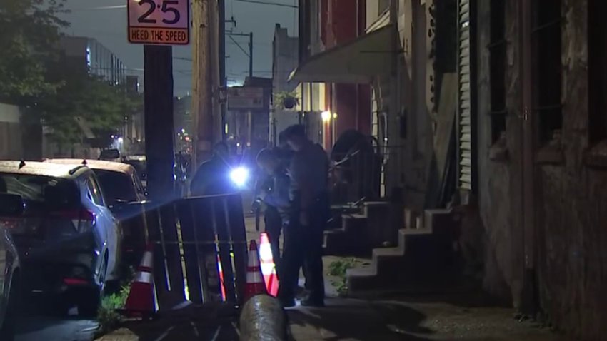 Police investigate after a man was shot in the stomach during a fight near the intersection of 21st and Berks streets in North Philadelphia on Monday night.