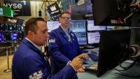 Traders work on the floor at the New York Stock Exchange in New York City, U.S., July 14, 2025.
