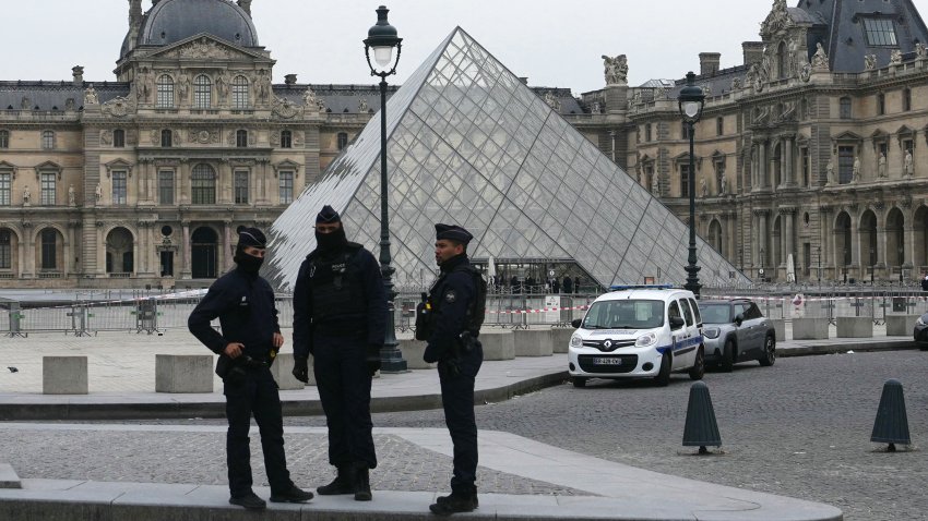 French police officers stand in front of the Louvre Museum after robbery, in Paris on October 19, 2025. Robbers broke in to the Louvre and fled with jewellery on October 19, 2025 morning, a source close to the case said, adding that its value was still being evaluated. A police source said an unknown number of thieves arrived on a scooter armed with small chainsaws and used a goods lift to reach the room they were targeting. (Photo by Dimitar DILKOFF / AFP) / — IMAGE RESTRICTED TO EDITORIAL USE – STRICTLY NO COMMERCIAL USE — (Photo by DIMITAR DILKOFF/AFP via Getty Images)