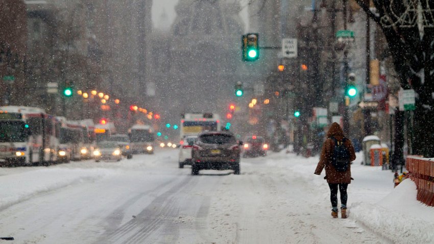 PHILADELPHIA, PA  – FEBRUARY 13: Residents walk through the snow covered streets on February 13, 2014 in Philadelphia, Pennsylvania. The east coast was hit with a winter snowstorm bringing sleet and snow. (Photo by Jessica Kourkounis/Getty Images)