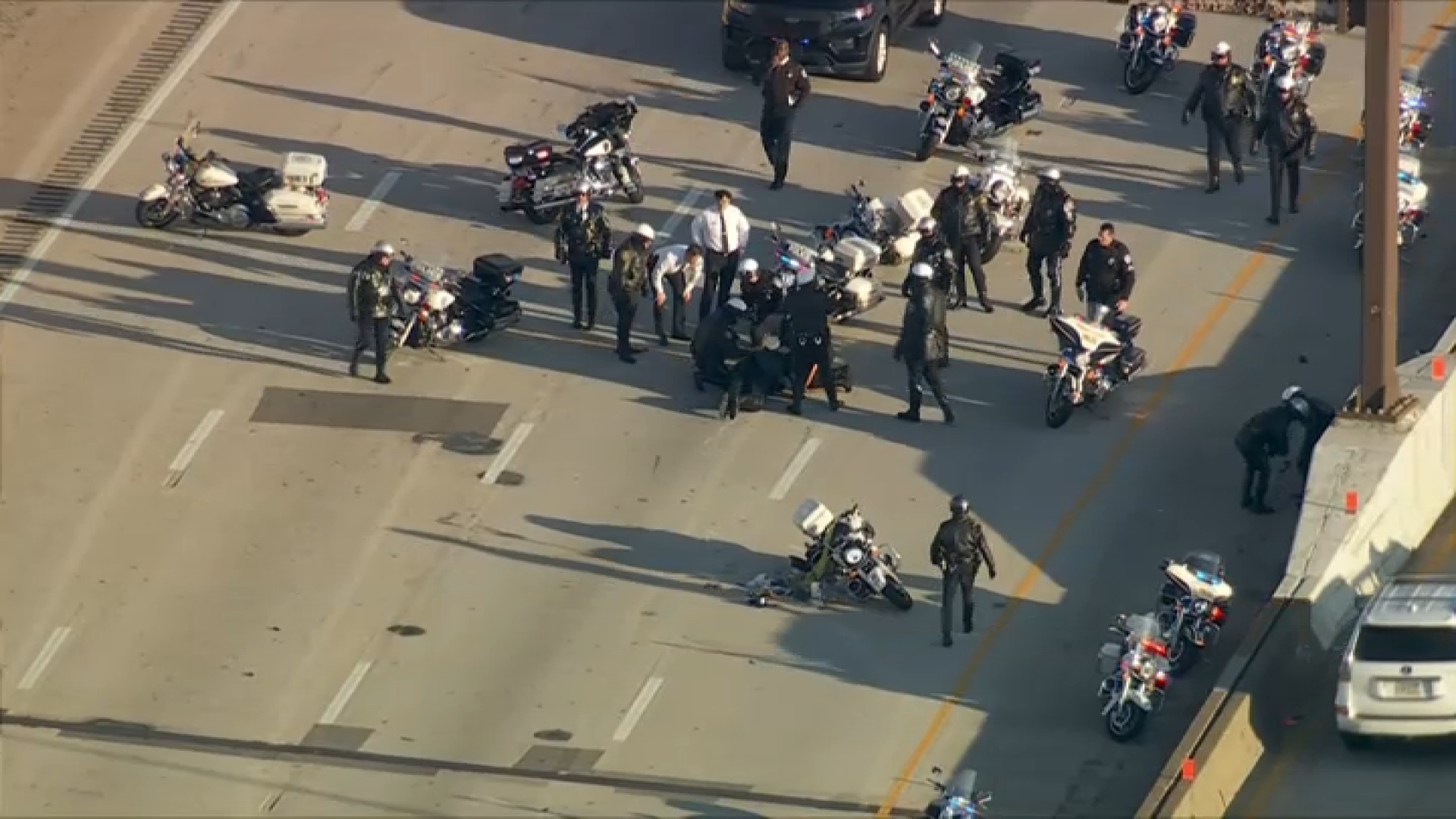 Live: Police motorcyclist wipes out on I-95 in procession to Camp Out for Hunger