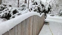 Picture of the sticky snow accumulation on top of a fence in Narberth.