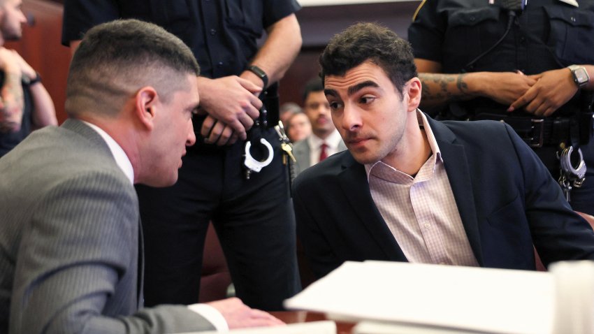Luigi Mangione confers with attorney Jacob Kaplan (L) in Manhattan Supreme Court during a state court evidentiary hearing in the murder case of UnitedHealthcare CEO Brian Thompson, in New York, on December 2, 2025.