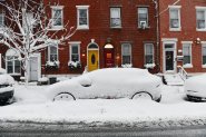 PHILADELPHIA, PENNSYLVANIA - FEBRUARY 23: Residents in Philadelphia dig out their cars as heavy snow continues to fall on February 23, 2026 in Philadelphia, Pennsylvania. A Nor'Easter brought over a foot of snow to some areas along the east coast impacting travel throughout the region, with snow continuing until the afternoon. (Matthew Hatcher/Getty Images)