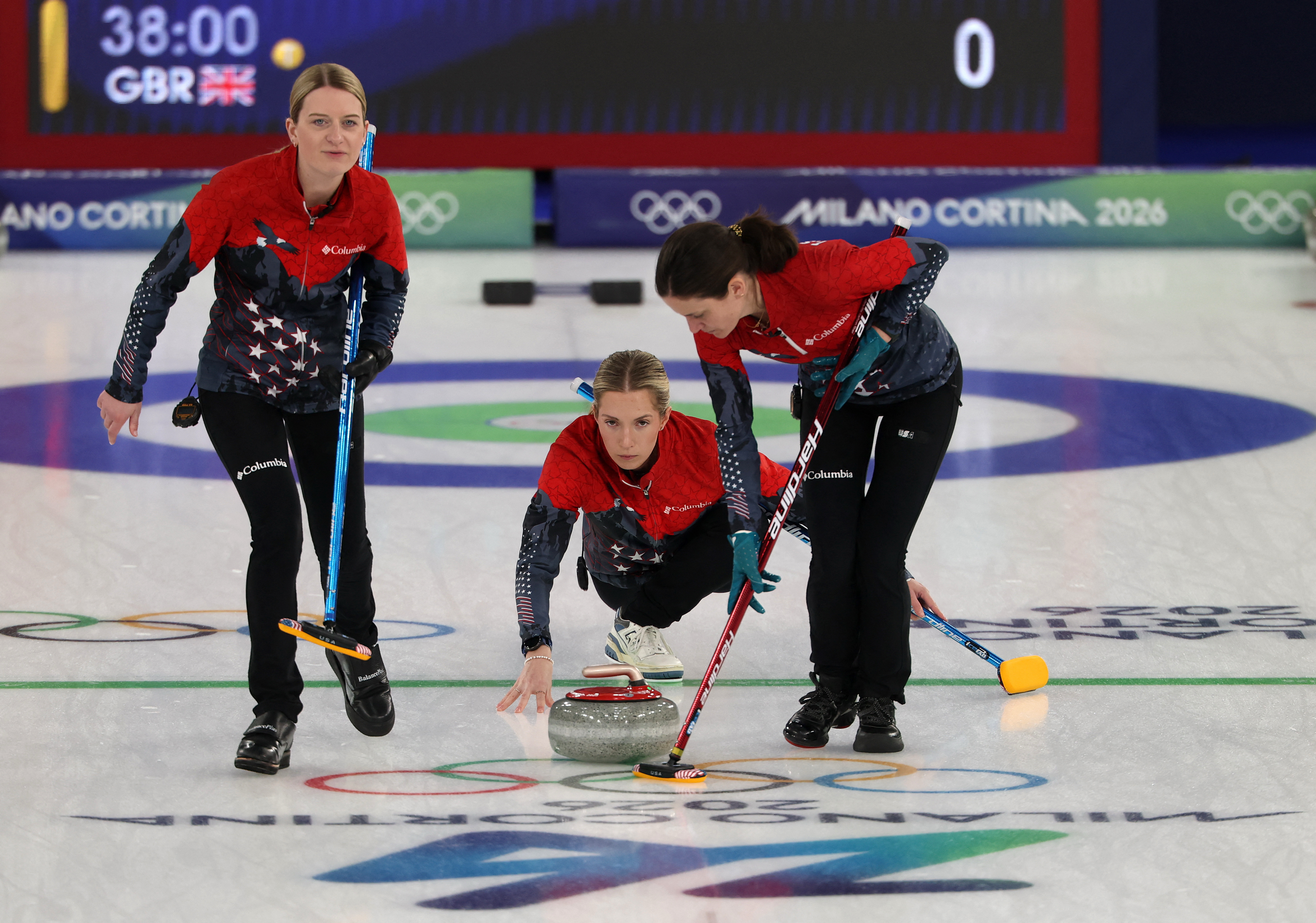 Women's curling team in action