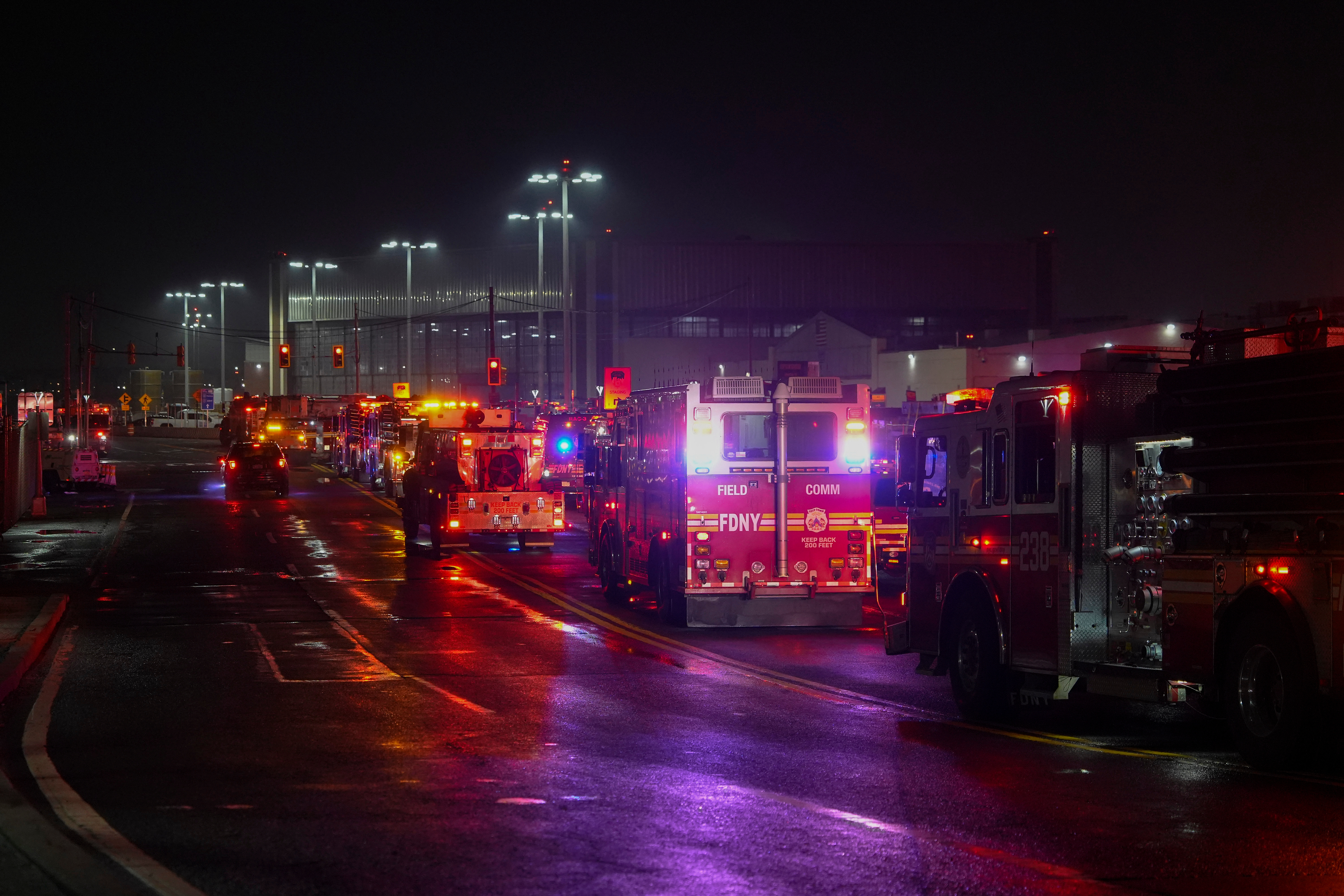 Firetrucks lineup outside LaGuardia Airport, Monday, March 23, 2026, in New York, after an Air Canada Jet collided with a Port Authority vehicle on a runway.