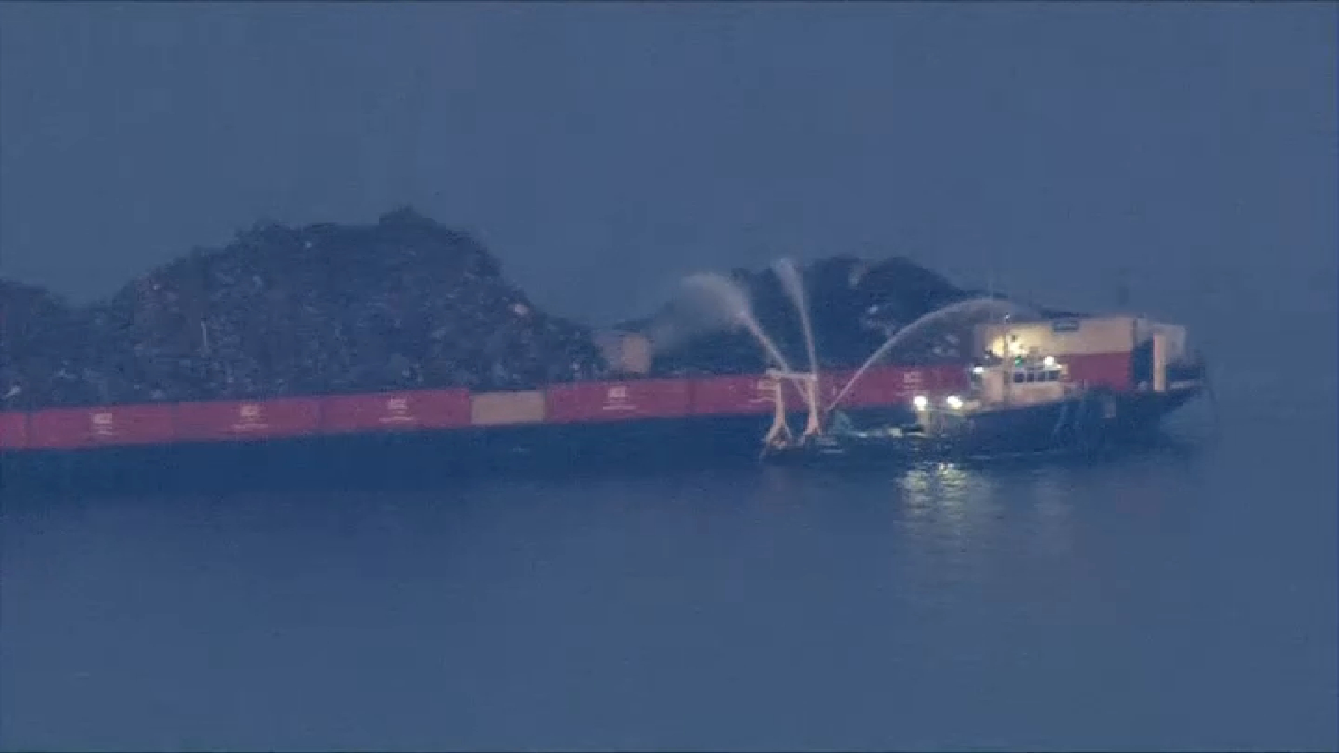 For second day, crews work to extinguish burning barge on the Delaware River