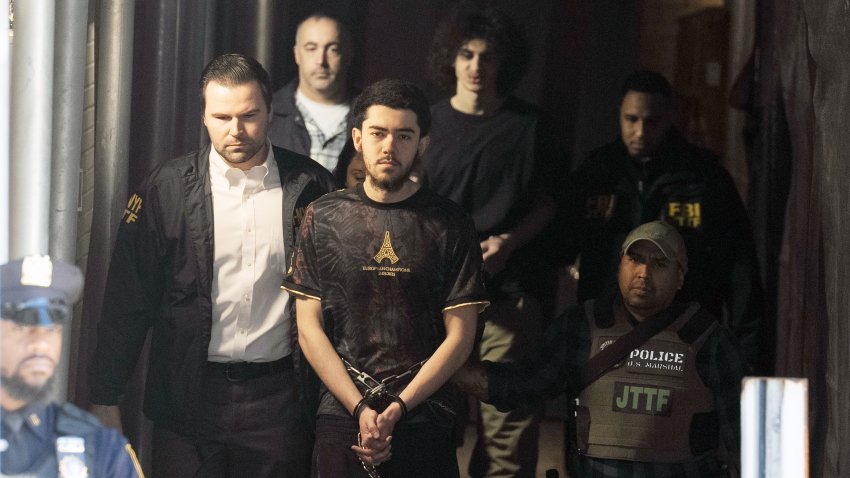 The suspects in the attempted bombing during a protest near Gracie Mansion are pictured in federal custody leaving the NYPD’s 26th Precinct stationhouse in Manhattan on Monday, March 9, 2026. (Barry Williams / New York Daily News via Getty Images)