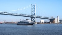 Philadelphia, Pennsylvania: February 23, 2020: The Spirt of Philadelphia cruise ship passes under the Ben Franklin Br...
