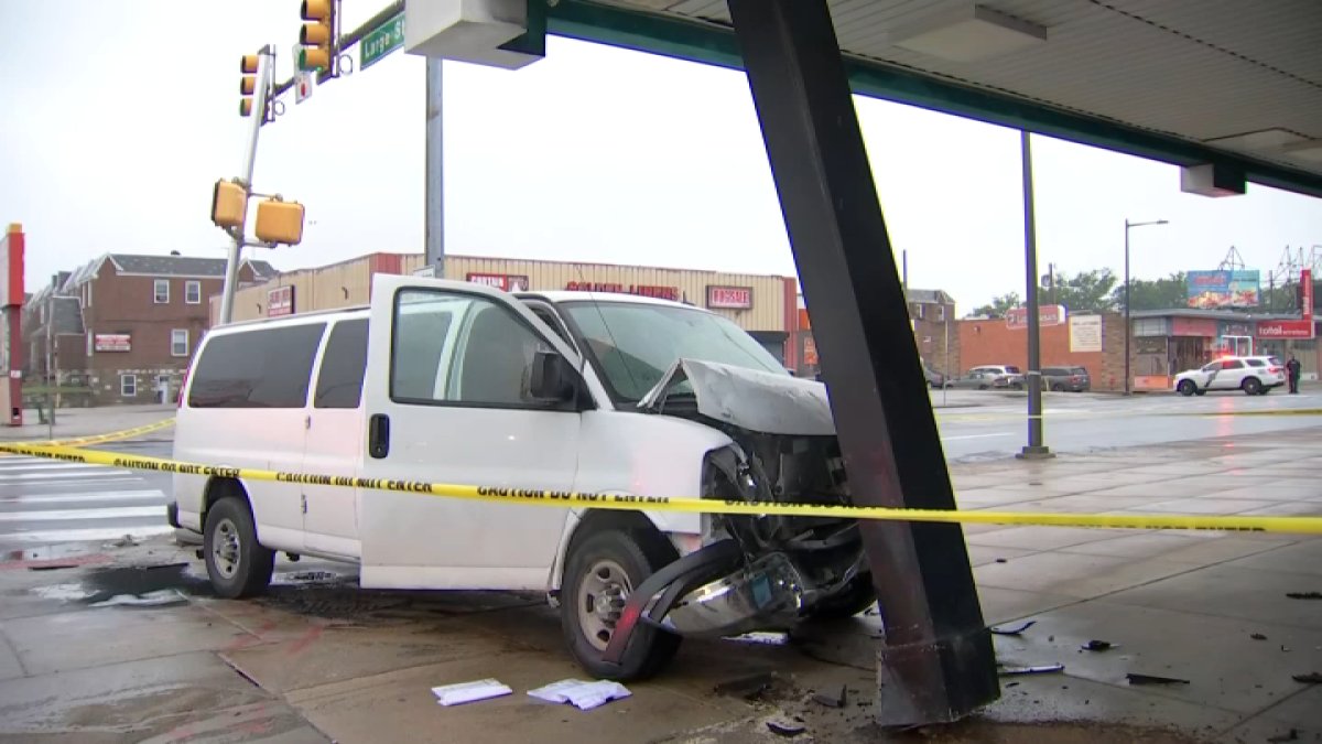 Two-vehicle crash sends minivan into building along Philadelphia street