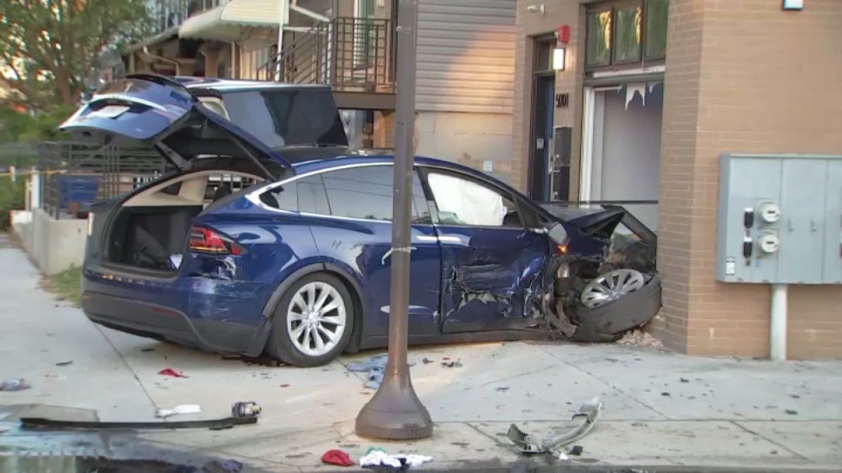 1 hurt after car strikes police cruiser, drives into building in West Philly