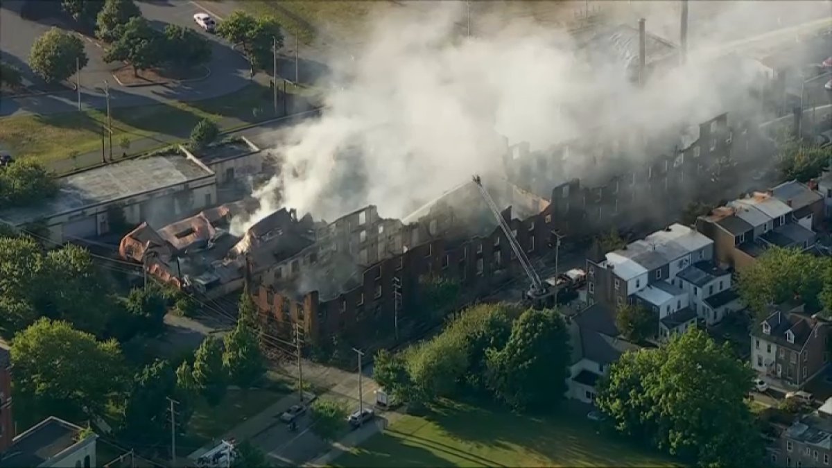 Smoke continues to pour from rubble after massive Allentown warehouse fire