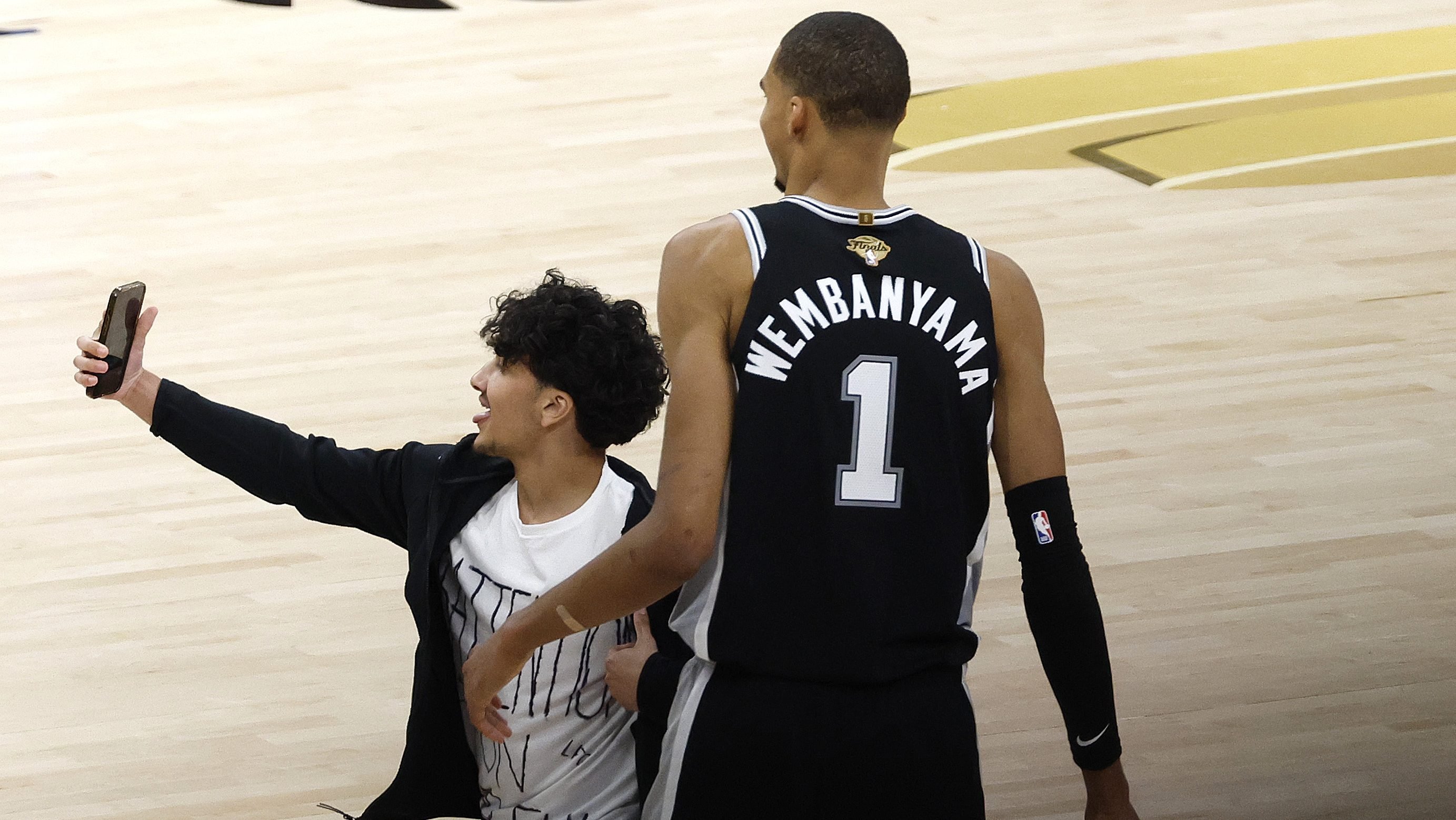 NBA bans fan for life after running onto court to attempt selfie with Wembanyama