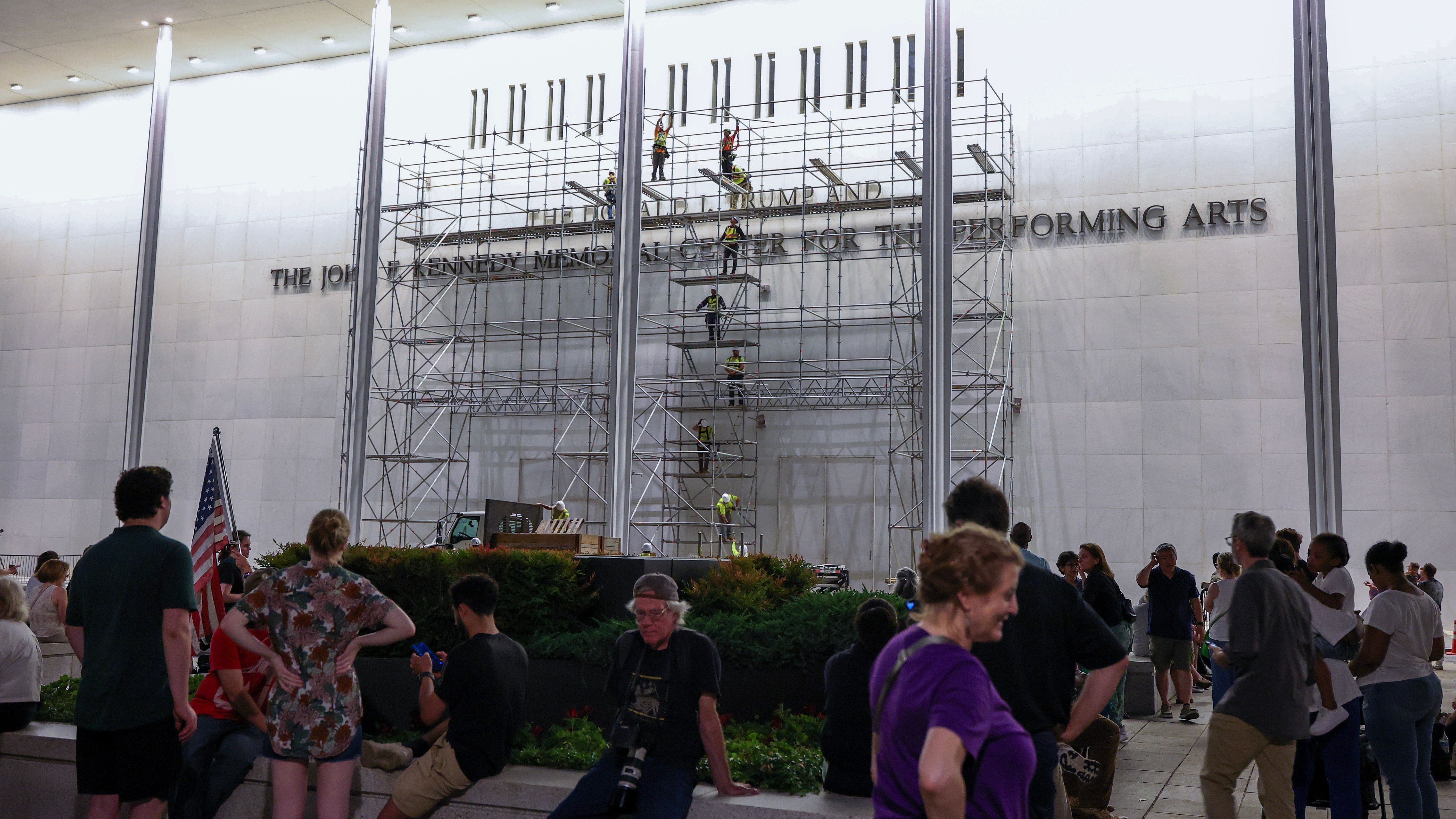 Workers begin removing Trump's name from Kennedy Center hours after court-ordered deadline
