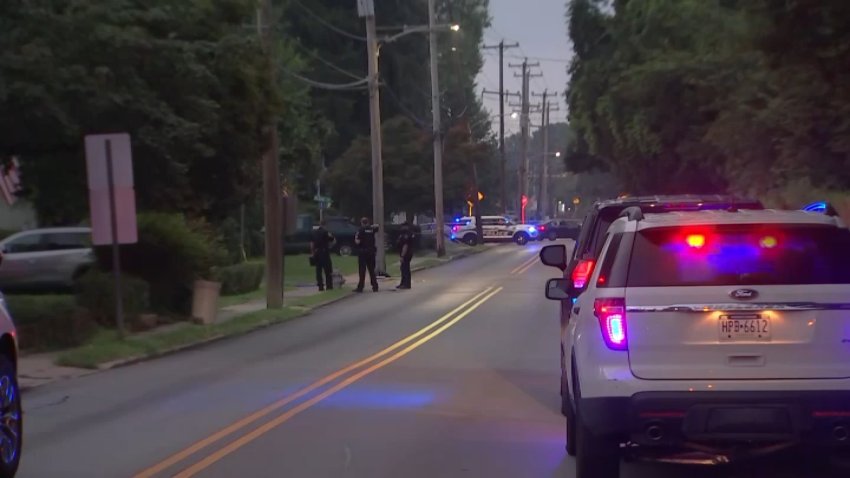 Police close off parts of Clifton Avenue in Aldan for an investigation into a shooting early Thursday.