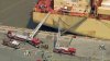 Firefighters respond to fire in the Dole Columbia at the Port of Wilmington