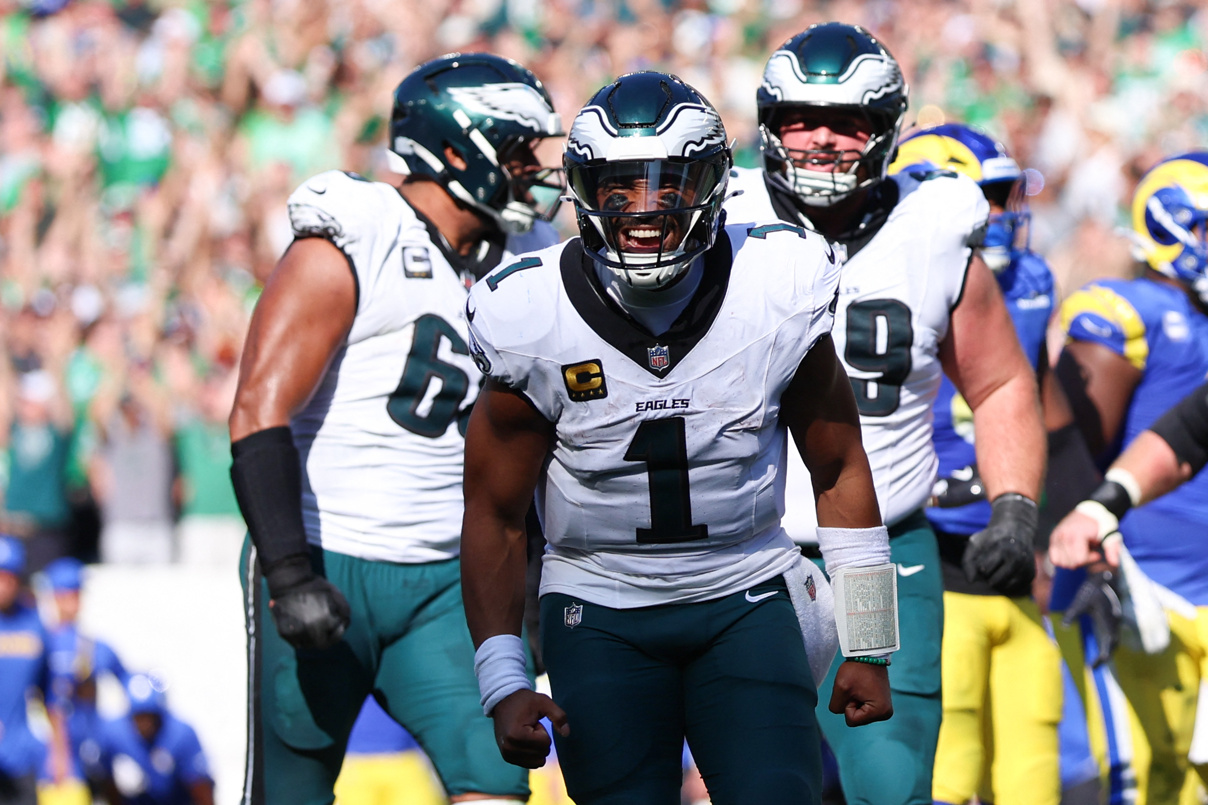 Sep 21, 2025; Philadelphia, Pennsylvania, USA; Philadelphia Eagles quarterback Jalen Hurts (1) reacts after a touchdown pass to wide receiver Devonta Smith (not pictured) during the fourth quarter against the Los Angeles Rams at Lincoln Financial Field. Mandatory Credit: Bill Streicher-Imagn Images