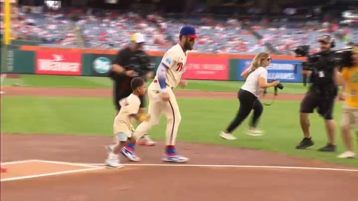 Boy who beat cancer runs the bases with Bryce Harper at Phillies game