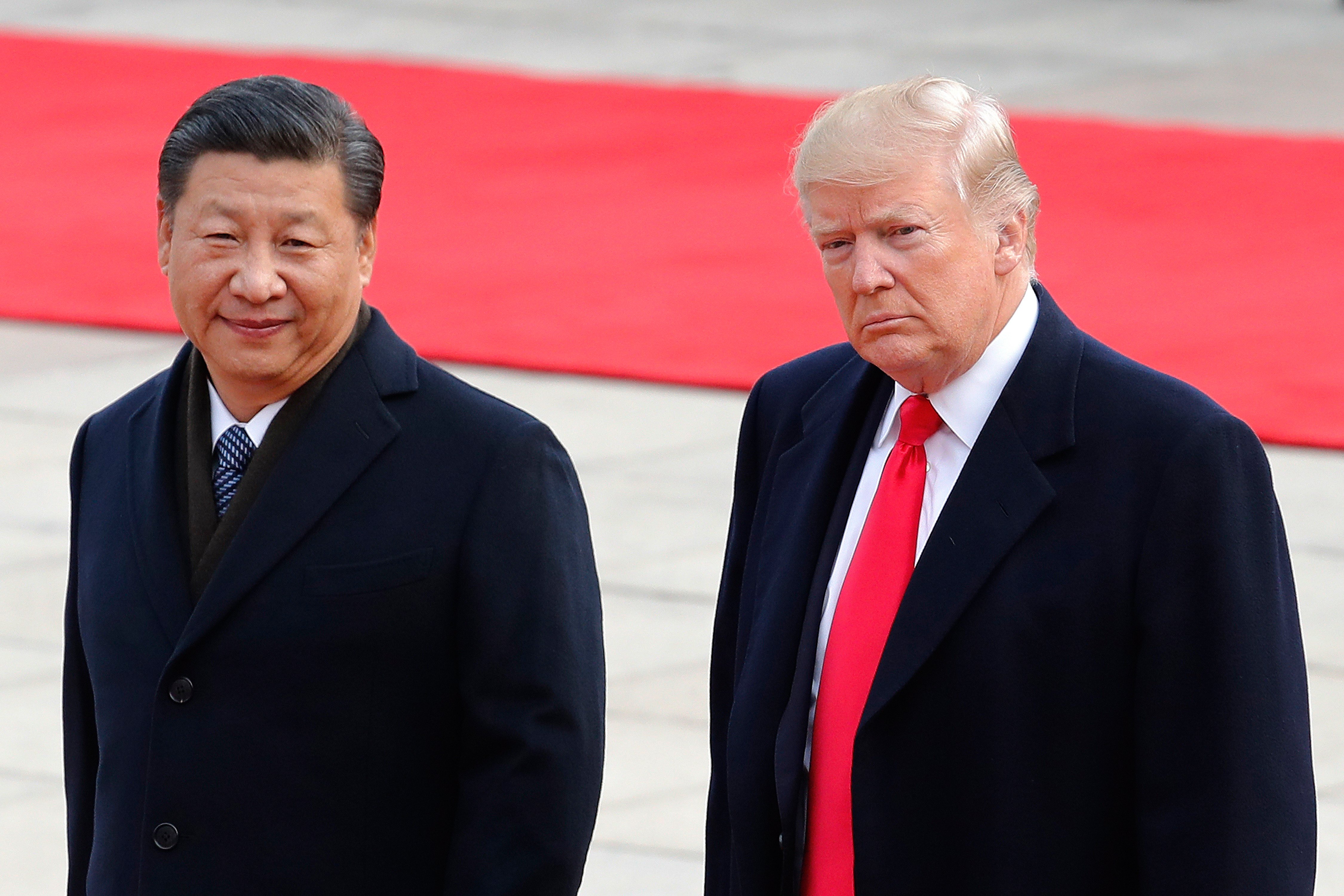 China's Xi kicks off state visit to Washington with a rare planeside welcome from Trump