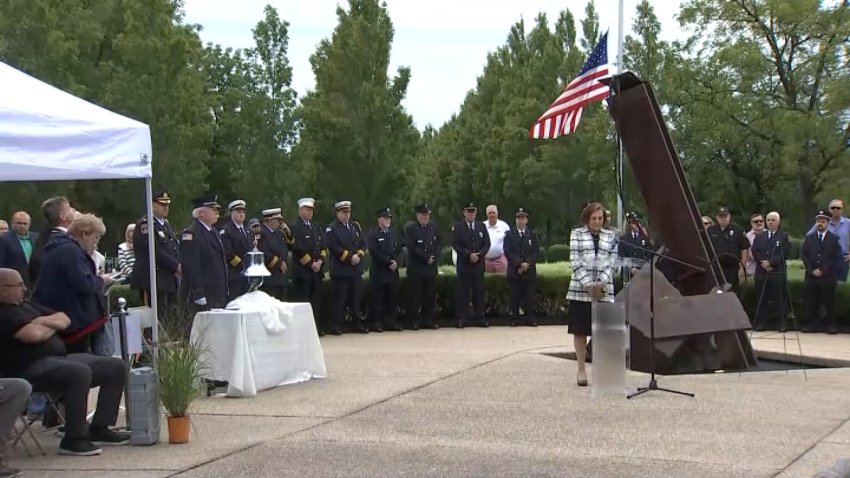 Officials gather for a 9-11 memorial ceremony at the Garden of Refection in Lower Makefield on Friday.